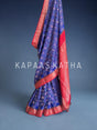Buy pure Vasundhara silk Bandhani saree in royal blue with contrast crimson red zari border & rich pallu. Authentic handwoven luxury online at Kapaas Katha.