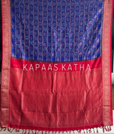 Buy pure Vasundhara silk Bandhani saree in royal blue with contrast crimson red zari border & rich pallu. Authentic handwoven luxury online at Kapaas Katha.