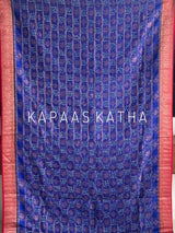 Buy pure Vasundhara silk Bandhani saree in royal blue with contrast crimson red zari border & rich pallu. Authentic handwoven luxury online at Kapaas Katha.