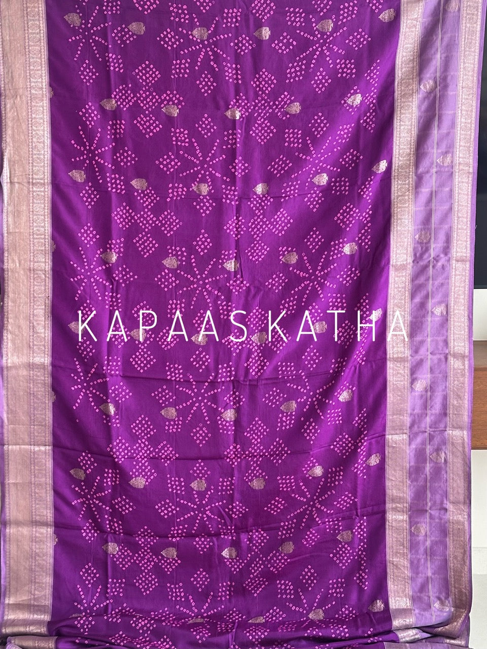 Buy pure Vasundhara silk Bandhani saree in royal magenta purple with gold zari leaf motifs & silver zari border. Authentic handwoven luxury online at Kapaas Katha.