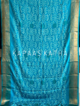 Buy pure Vasundhara silk Bandhani saree in turquoise blue with gold zari leaf motifs & rich pallu. Authentic handwoven luxury online at Kapaas Katha.
