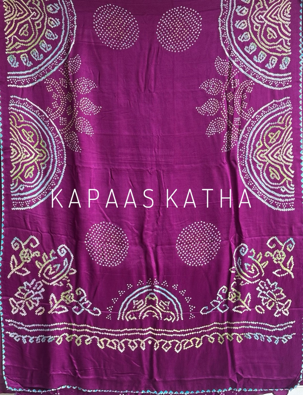 Kapaas Katha presents Leher Grandeur Pure Gajji Silk Bandhani Saree, draped in wave-like bandhani artistry & pure silk grandeur. Shop now!