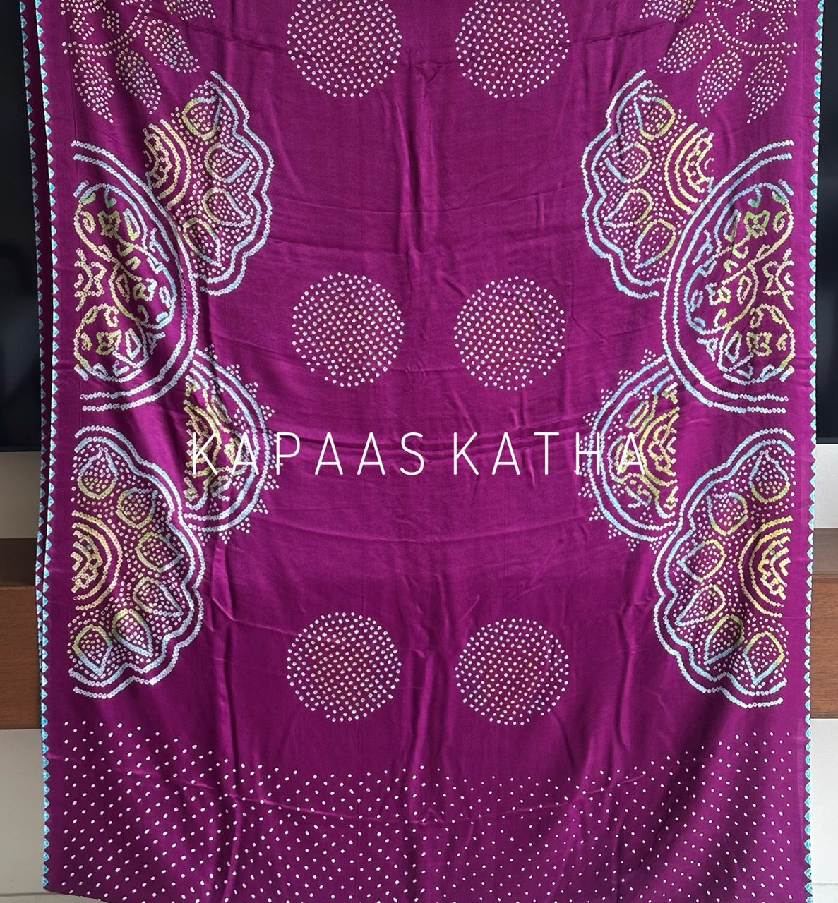 Kapaas Katha presents Leher Grandeur Pure Gajji Silk Bandhani Saree, draped in wave-like bandhani artistry & pure silk grandeur. Shop now!