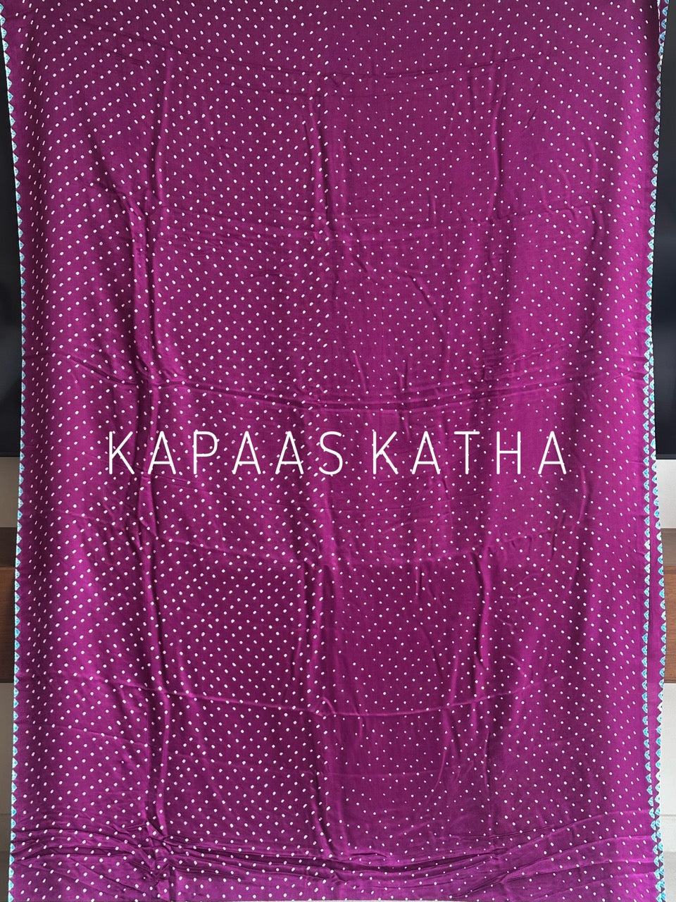 Kapaas Katha presents Leher Grandeur Pure Gajji Silk Bandhani Saree, draped in wave-like bandhani artistry & pure silk grandeur. Shop now!