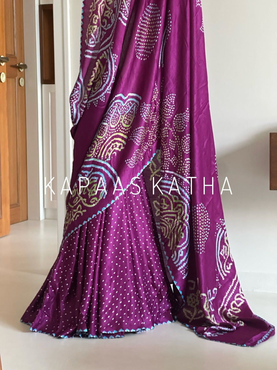 Kapaas Katha presents Leher Grandeur Pure Gajji Silk Bandhani Saree, draped in wave-like bandhani artistry & pure silk grandeur. Shop now!