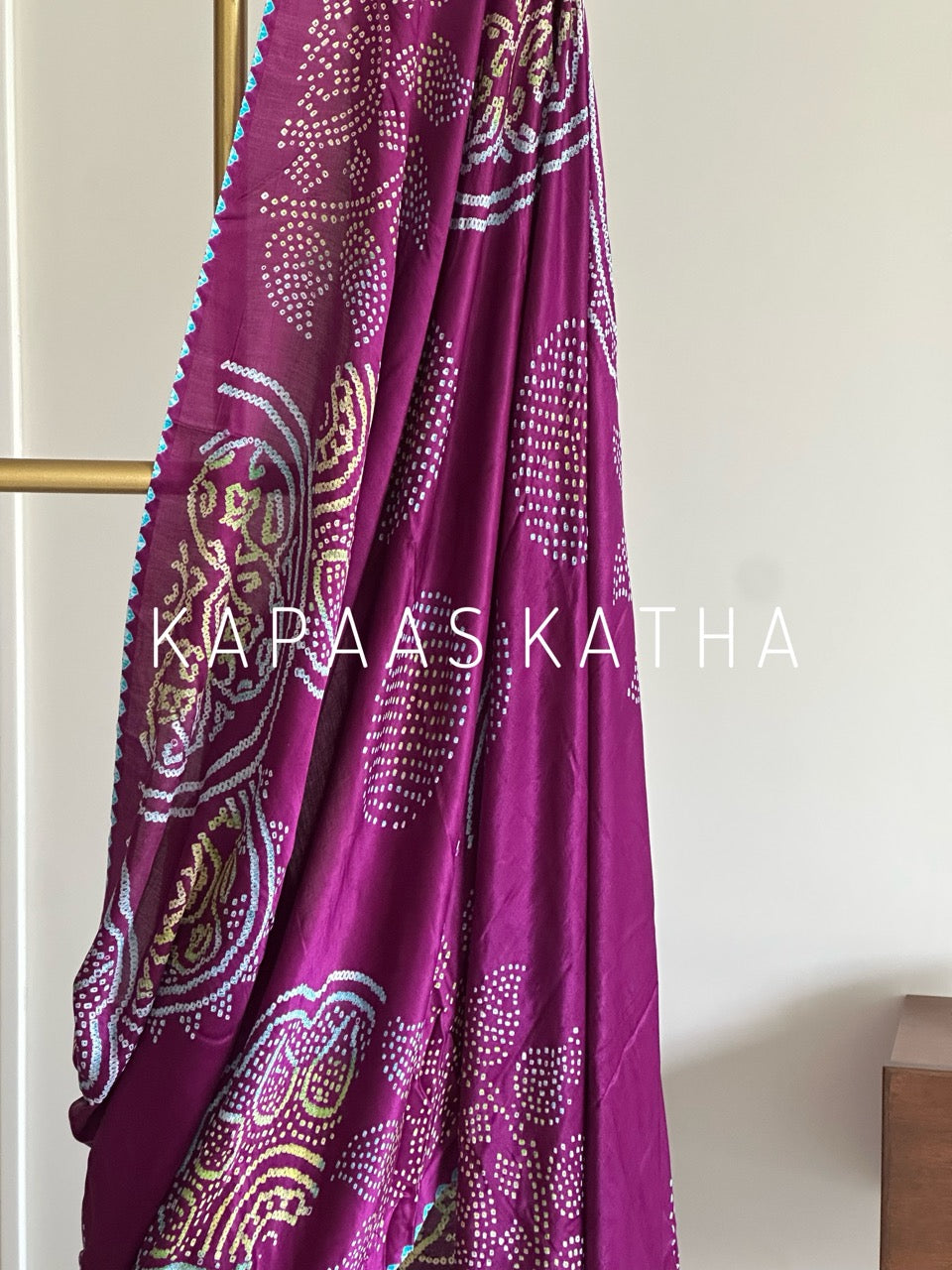 Kapaas Katha presents Leher Grandeur Pure Gajji Silk Bandhani Saree, draped in wave-like bandhani artistry & pure silk grandeur. Shop now!