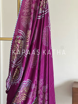 Kapaas Katha presents Leher Grandeur Pure Gajji Silk Bandhani Saree, draped in wave-like bandhani artistry & pure silk grandeur. Shop now!