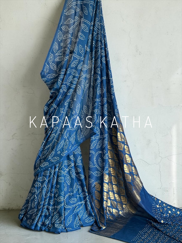 Shop stylish pure Munga Silk Bandhani saree featuring gold zari floral mandalas and paisley pallu. Lightweight, vibrant, and ideal for festive celebrations.