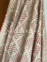 Buy pure Munga silk Bandhani saree in linen beige with soft red ghangura border. Lightweight handloom elegance for daytime festivities at Kapaas Katha.