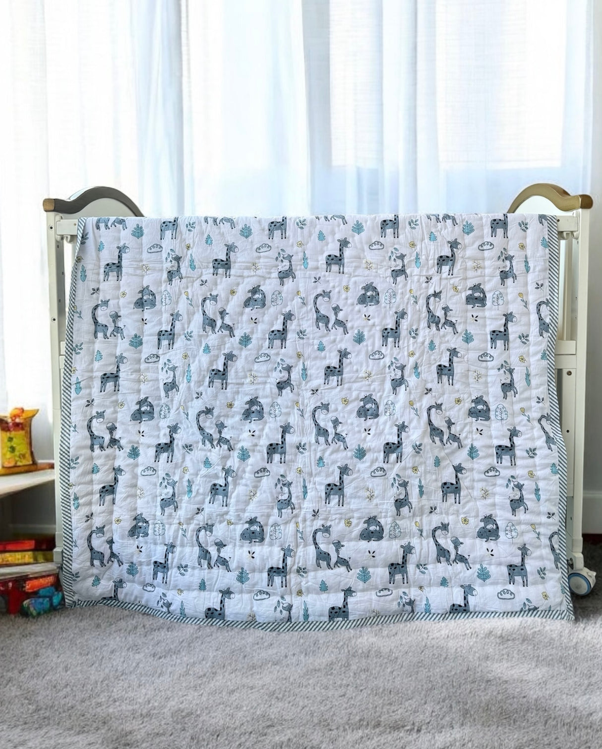 minimalist baby quilt with monochrome giraffe and bunny print for return favors and gifting in Kuwait and Australia