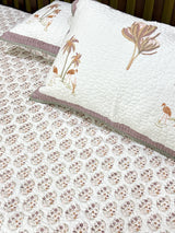 quilted-bedcover-styled-on-bed