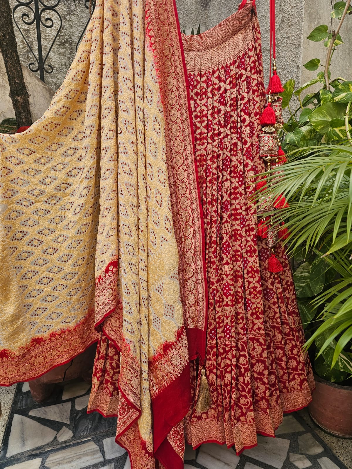 Mesmerizing Red Pure Banarsi Georgette Bandhani Lehenga with Ivory Dupatta