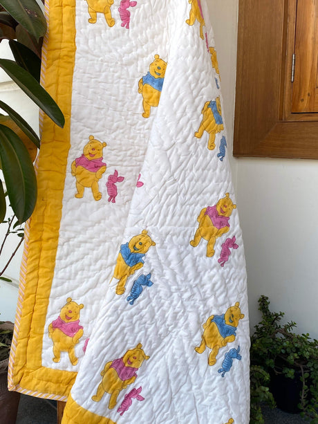 handcrafted-soft-cotton-quilt-with-cute-pooh-print-in-blue-and-pink-for-retail-and-bulk-orders-in-uae