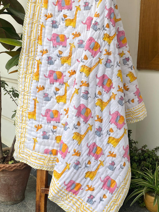 handcrafted elephant and giraffe themed kids quilt in breathable cotton reversible design perfect for return favors in UAE and Australia