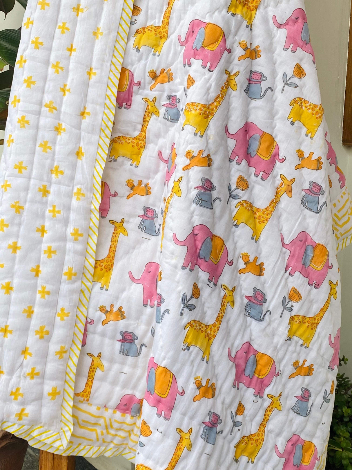 best selling reversible jungle animal quilt with elephant and giraffe design in pure cotton perfect for toddler gifting in Australia and New Zealand