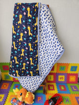 eco friendly kids quilt with blue animal and space elements handmade in India for return favors in UK and South Africa