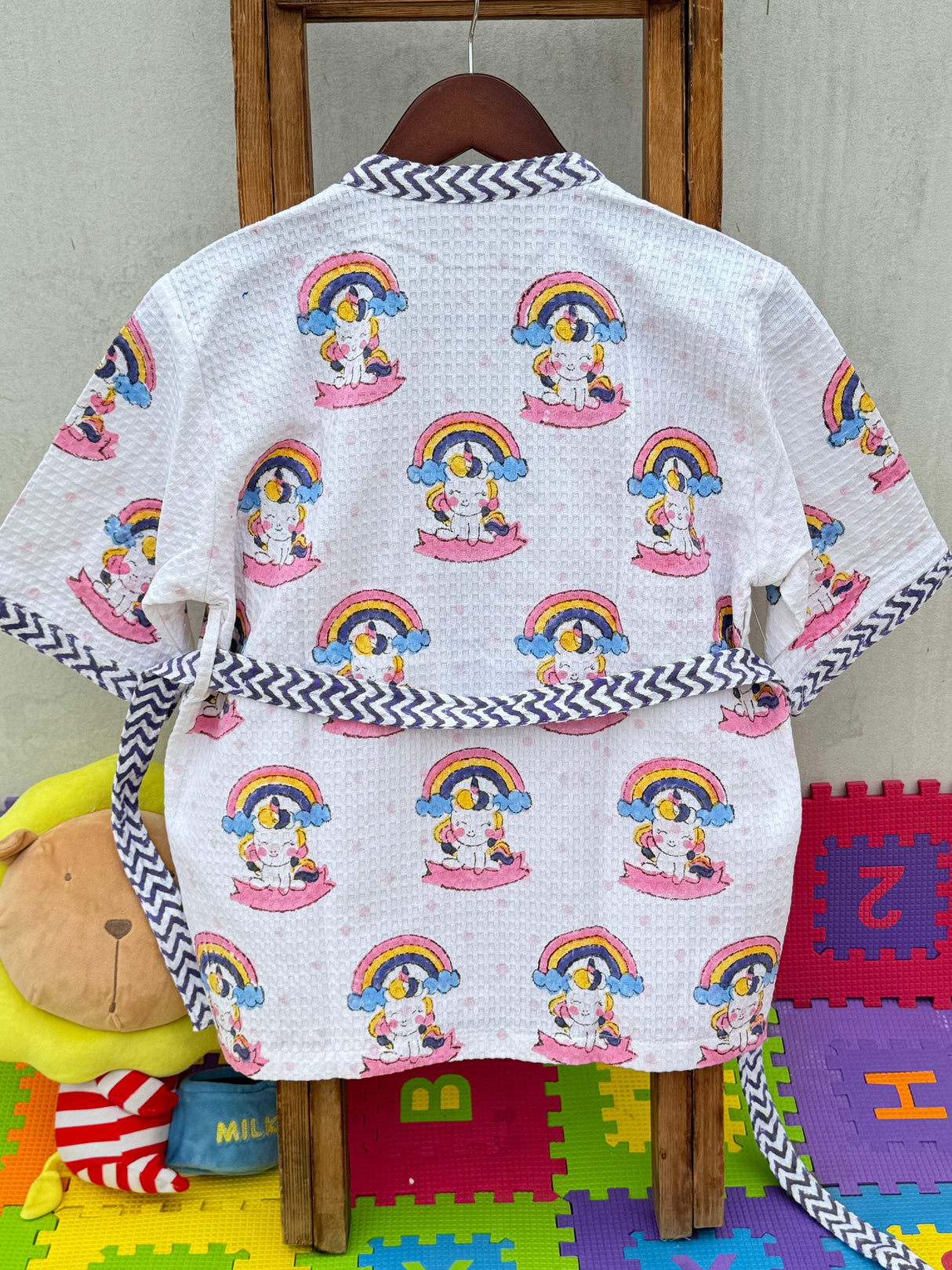 handcrafted unicorn theme girls bathrobe in cotton waffle fabric with embroidered name perfect for party favors and export