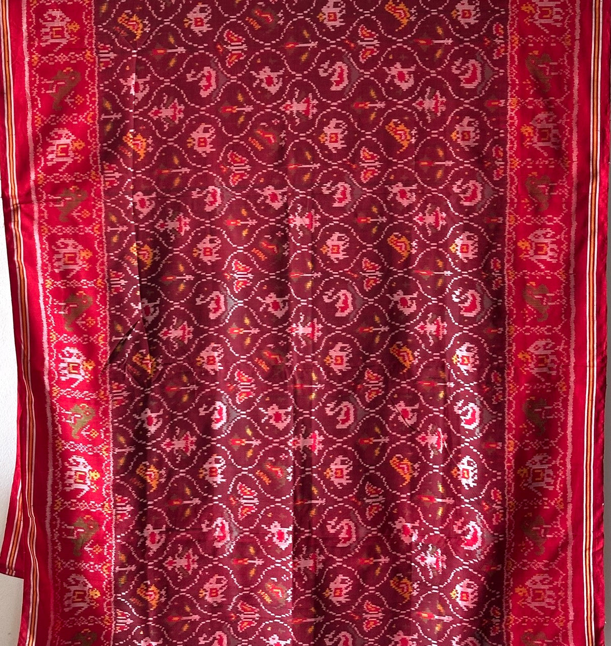 sophisticated-handloom-brown-and-red-mulberry-silk-ikat-patola-saree-with-animal-motifs