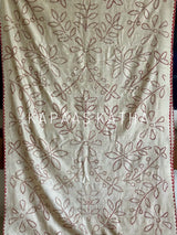 Buy pure Munga silk Bandhani saree in linen beige with soft red ghangura border. Lightweight handloom elegance for daytime festivities at Kapaas Katha.