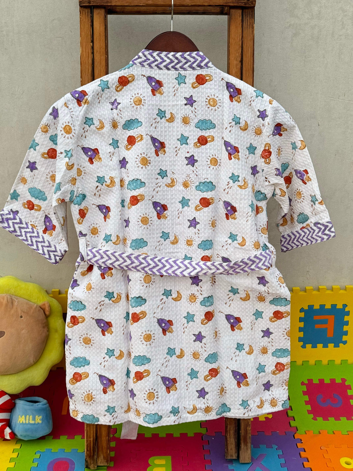 space-themed kids bathrobe made from pure cotton waffle fabric, ideal for daily use and vacations worldwide